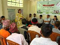 A departmental official delivers an awareness session on organic farming, soil health management, and government schemes under the Khet Bachao Abhiyan.