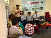 A resource person addresses farmers during the Khet Bachao Abhiyan awareness programme at Sumin Lingzey, highlighting sustainable agriculture and government initiatives for farmers.